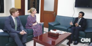 Ali Pervaiz Malik and Joe Moir seated during a meeting at the Ministry of Petroleum, discussing bilateral energy cooperation.