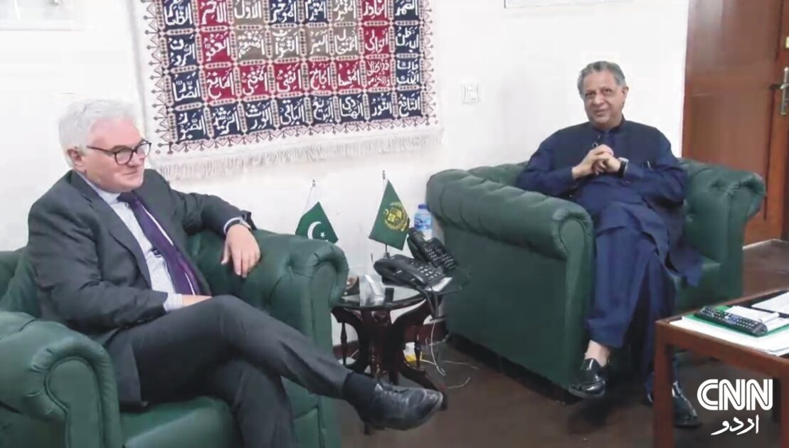 German Ambassador Alfred Grannas and Minister Azam Nazeer Tarar seated in a formal meeting room, discussing bilateral relations.