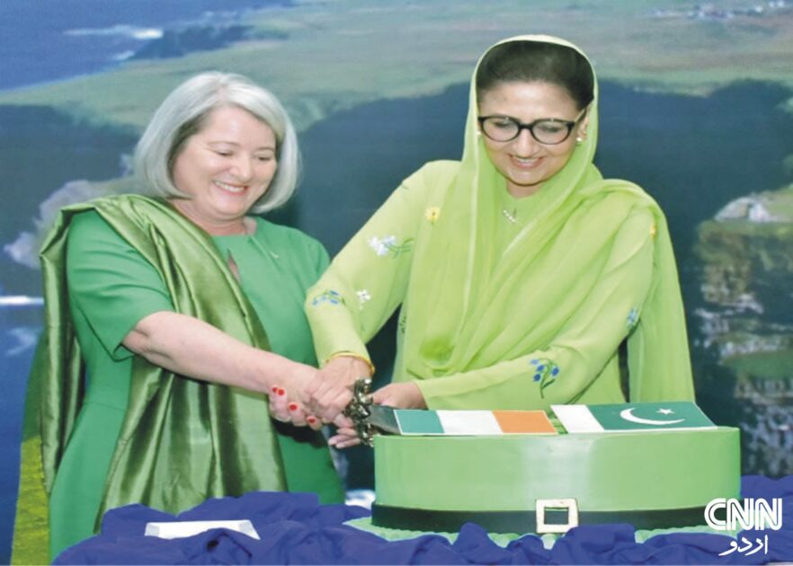 Ambassador Mary O’Neil and Minister Dr. Shezra Mansab Ali Khan Kharal cutting a cake at Ireland’s St. Patrick’s Day event in Islamabad.
