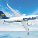 Ryanair aircraft parked at Memmingen Airport after an emergency landing due to turbulence, with emergency personnel assisting passengers.