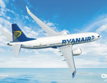 Ryanair aircraft parked at Memmingen Airport after an emergency landing due to turbulence, with emergency personnel assisting passengers.